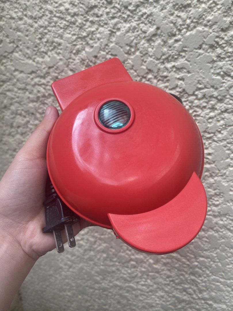 Red Mini Heart Waffle Maker (Category: Cookware & Accessories) located in Las Pinas. Submitted by stylishchique (Listing ID 1468541429, Image 1). Description: - Color: Vibrant red exterior with clean black interior - Feature: Makes adorable heart-shaped waffles - Design: Compact size, perfect for dorms and small kitchens - Performance: Heats up fast for quick breakfasts - Condition: Non-stick plates with zero batter buildup - Power: Electric plug