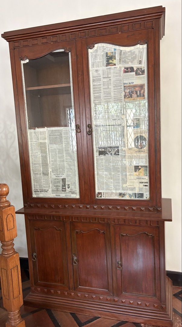 Red Narra China Cabinet and Buffet Table (Category: Shelves, Cabinets & Racks) located in Quezon City. Submitted by jennybug (Listing ID 1468591876, Image 2). Description: Red narra two-piece China cabinet and buffet table. China cabinet: Solid wood build with glass doors on top section and lots of shelving inside and in lower cabinets. Dimensions: 4ft (length) X 20in (width) x 7ft 2in (height). Buffet Table: Cabinets and pull-out drawers for sto