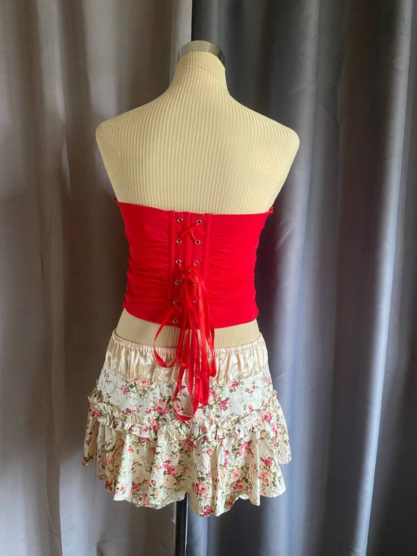 Red Strapless Lace-Up Corset Top (Category: Sleeveless) located in Cagayan de Oro. Submitted by curated_closetph (Listing ID 1468555347, Image 3). Description: — Size: M - L — Color: Red — Ruched stretch fabric — Strapless bandeau neck — Lace-up grommet back — Pointed asymmetrical hem — Side zipper closure — Can negotiate the price — 🛒 Shop more to get more discounts and freebies!.