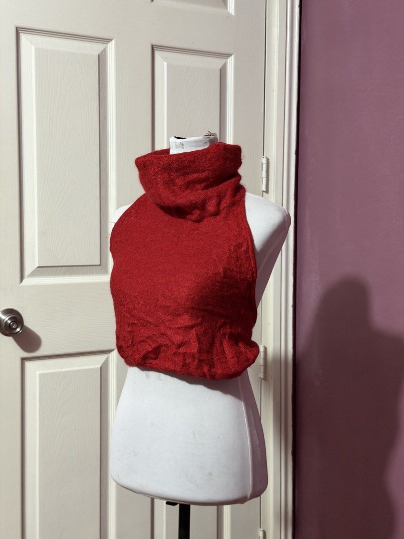 Red Turtleneck Halter Open Back Top (Category: Sleeveless) located in Manila. Submitted by thatgirl0001 (Listing ID 1468593531, Image 2). Description: - Color: Bright red - Style: Halter turtleneck crop top - Design: Sleeveless with a fuzzy knit texture - Fit: Stretchy, comfortable material ending at the waist - Versatility: Perfect for layering over long sleeves or wearing solo.