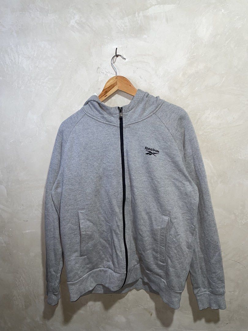 Reebok Grey Zip-Up Hoodie Jacket (Category: Coats, Jackets and Outerwear) located in Zamboanga. Submitted by guthens (Listing ID 1468539875, Image 1). Description: Condition- excellent Issue- none Color rate- 9.7/10 L-27 W-23 Large best fit.