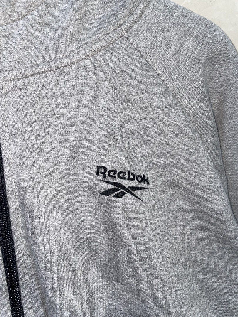 Reebok Grey Zip-Up Hoodie Jacket (Category: Coats, Jackets and Outerwear) located in Zamboanga. Submitted by guthens (Listing ID 1468539875, Image 2). Description: Condition- excellent Issue- none Color rate- 9.7/10 L-27 W-23 Large best fit.