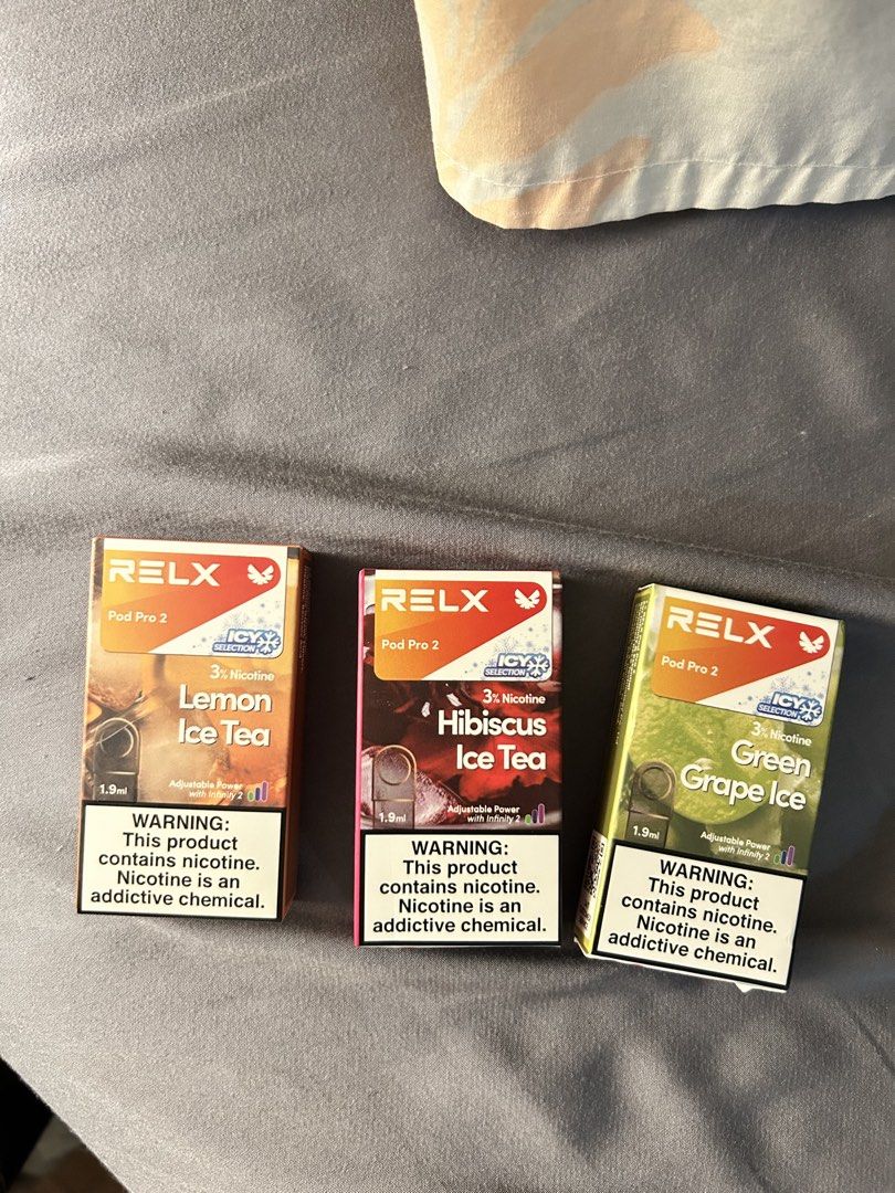 RELX Infinity 2 vape device with pods bundle (Category: Other Gadgets) located in Paranaque City. Submitted by cece14237 (Listing ID 1468561618, Image 1). Description: - Item: RELX Infinity 2 Device Artisan with Pods Bundle - Color/Material: Beige Leather Wrap (Note: minor peeling and wear on the vertical strip) - Pods Included: 3 sealed Pod Pro 2 boxes - Flavors: Lemon Ice Tea, Hibiscus Ice Tea, and Green Grape Ice - Nicotine Strength: 3% (1.9ml