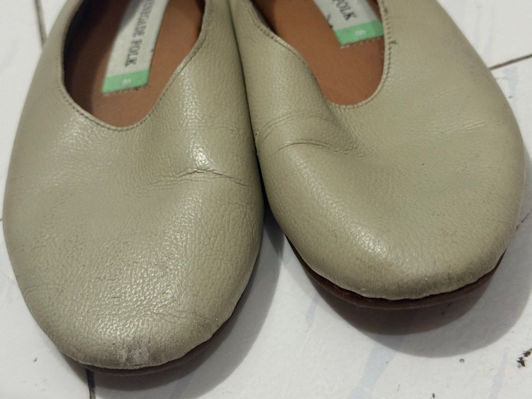 Renegade Folk Leather Flats Size 8 (Category: Flats & Sandals) located in Mandaluyong City. Submitted by trovebya (Listing ID 1468584329, Image 2). Description: - Brand/Item: Renegade Folk leather slip-on flats - Color: Beige with brown inner lining - Size: 8 - Features: Soft textured upper, branded insoles - Condition: Minor scuff marks and wear at the front toes - Style: Comfortable everyday flats, easy to pair with casual outfits.