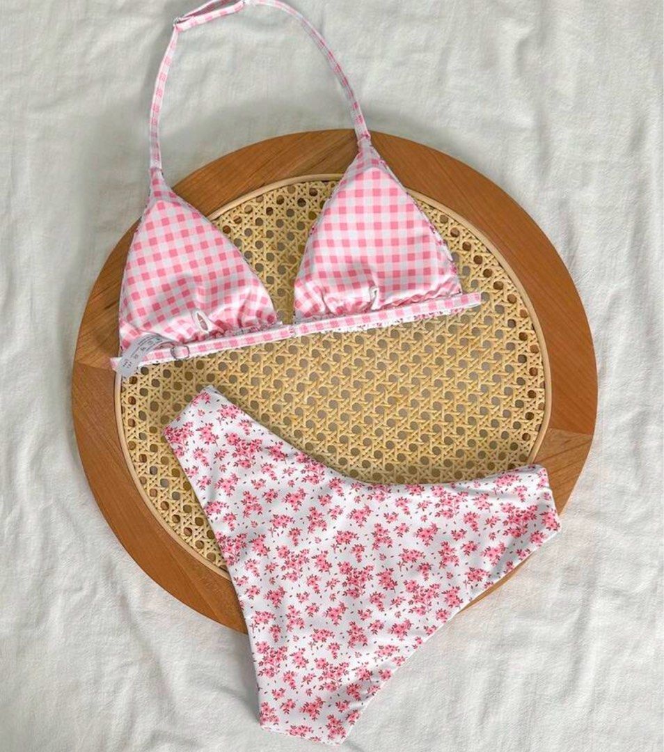 Reversible Pink Gingham and Floral Print Bikini (Category: Bikinis & Swimsuits) located in Manila. Submitted by julieeeewwwww (Listing ID 1468541402, Image 2). Description: Size: Bikini Tops - Underbust: 70-101 cm, Length: 19 cm, Straps Length: 43 cm Bikini Bottoms - Waist Size: 68-101 cm, Hip Size: 77 cm, Length: 25.5 cm - 2-in-1 Reversible design: Pink gingham on one side, delicate floral print on the other - Halter top with adjustable triangle