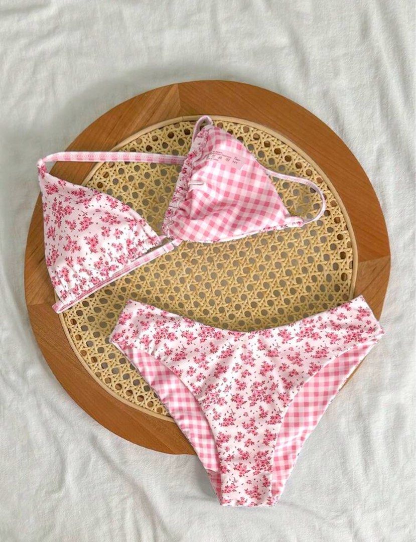Reversible Pink Gingham and Floral Print Bikini (Category: Bikinis & Swimsuits) located in Manila. Submitted by julieeeewwwww (Listing ID 1468541402, Image 1). Description: Size: Bikini Tops - Underbust: 70-101 cm, Length: 19 cm, Straps Length: 43 cm Bikini Bottoms - Waist Size: 68-101 cm, Hip Size: 77 cm, Length: 25.5 cm - 2-in-1 Reversible design: Pink gingham on one side, delicate floral print on the other - Halter top with adjustable triangle