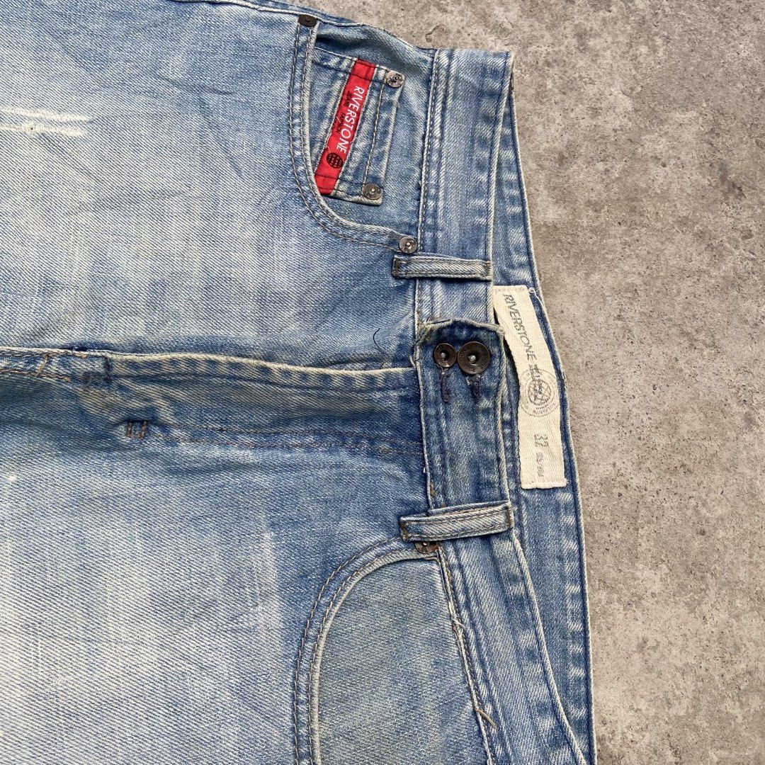 (RIVERSTONE) Light Blue Denim Washed Y2k Bootcut Pants (Category: Jeans) located in General Santos City (Dadiangas). Submitted by archive.grail (Listing ID 1468606308, Image 2). Description: waist/size: 32-34 (smaller waist? just wear a belt) thigh: 13 length: 42 hem: A9 - excellent condition - issue: missing design zipper at the back not noticeable - heavy, hard and thick fabric - good for daily wear - scratched design.