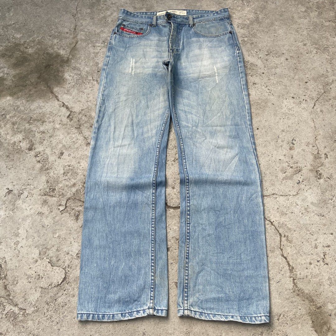 (RIVERSTONE) Light Blue Denim Washed Y2k Bootcut Pants (Category: Jeans) located in General Santos City (Dadiangas). Submitted by archive.grail (Listing ID 1468606308, Image 1). Description: waist/size: 32-34 (smaller waist? just wear a belt) thigh: 13 length: 42 hem: A9 - excellent condition - issue: missing design zipper at the back not noticeable - heavy, hard and thick fabric - good for daily wear - scratched design.