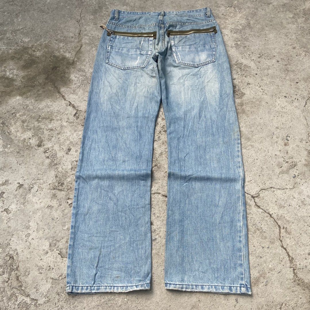 (RIVERSTONE) Light Blue Denim Washed Y2k Bootcut Pants (Category: Jeans) located in General Santos City (Dadiangas). Submitted by archive.grail (Listing ID 1468606308, Image 3). Description: waist/size: 32-34 (smaller waist? just wear a belt) thigh: 13 length: 42 hem: A9 - excellent condition - issue: missing design zipper at the back not noticeable - heavy, hard and thick fabric - good for daily wear - scratched design.