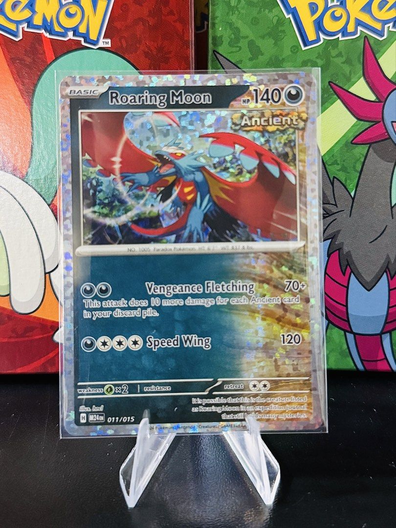 Roaring Moon (Category: Raw Singles) located in Bacarra. Submitted by retrovival (Listing ID 1468709160, Image 1). Description: 🌙 Roaring Moon 011/015 — M24EN Holo Promo Up for sale: this fierce Roaring Moon from the McDonald’s Pokémon promo set! It has 140 HP and a colorful holographic finish. ✨ ₱80 . Selling by piece; message me if interested! 📩.