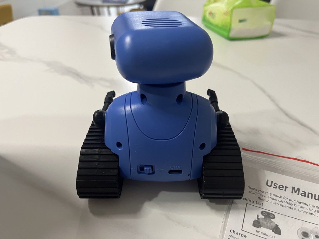 Robot toy (Category: Remote Control Toys) located in Singapore. Submitted by lingqing88 (Listing ID 1468614779, Image 2). Description: -Robert toy / friend for kid -remote controlled - eyes with lED lights, can sing / with songs - battery chargeable -like new condition ( played only 2 times ).