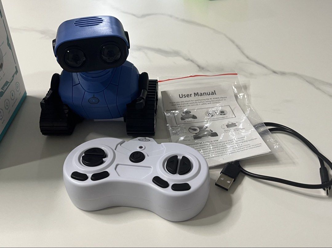 Robot toy (Category: Remote Control Toys) located in Singapore. Submitted by lingqing88 (Listing ID 1468614779, Image 1). Description: -Robert toy / friend for kid -remote controlled - eyes with lED lights, can sing / with songs - battery chargeable -like new condition ( played only 2 times ).