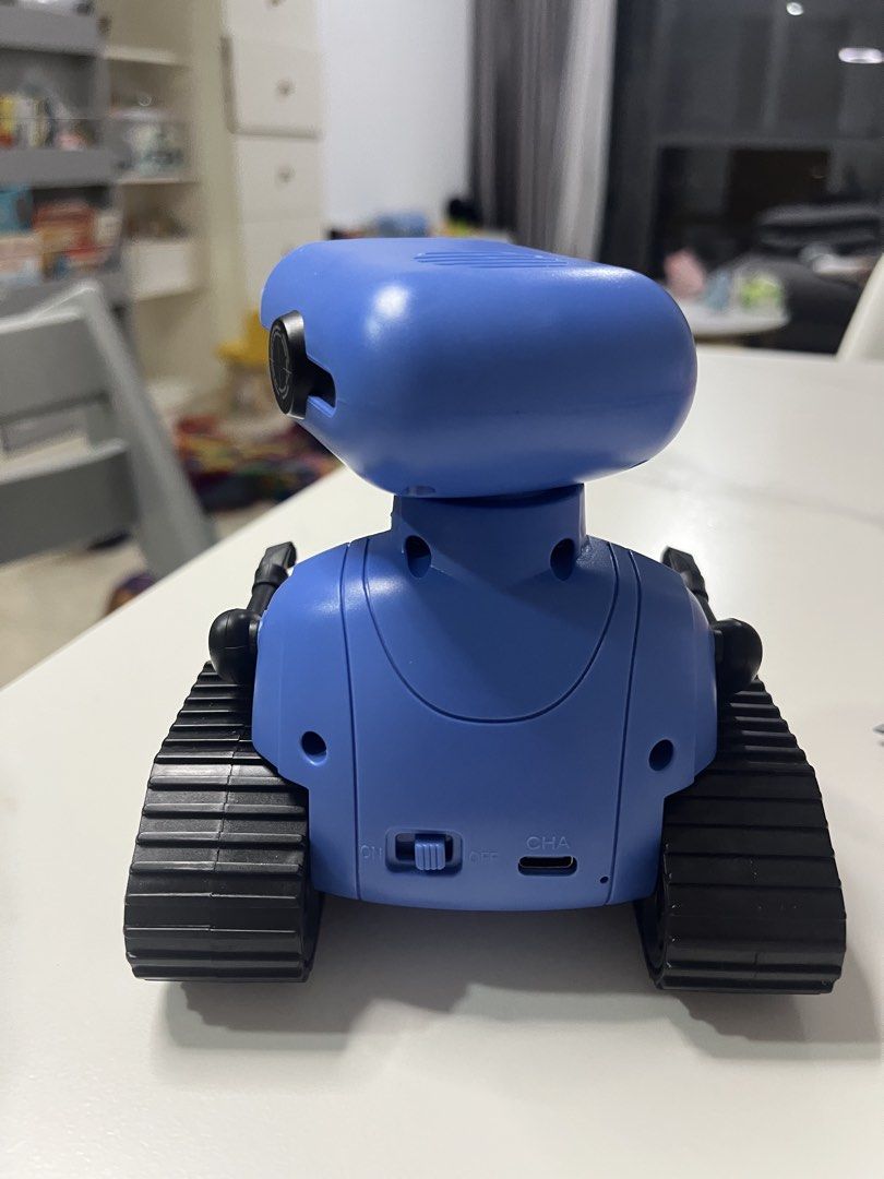 Robot toy (Category: Remote Control Toys) located in Singapore. Submitted by lingqing88 (Listing ID 1468614779, Image 10). Description: -Robert toy / friend for kid -remote controlled - eyes with lED lights, can sing / with songs - battery chargeable -like new condition ( played only 2 times ).