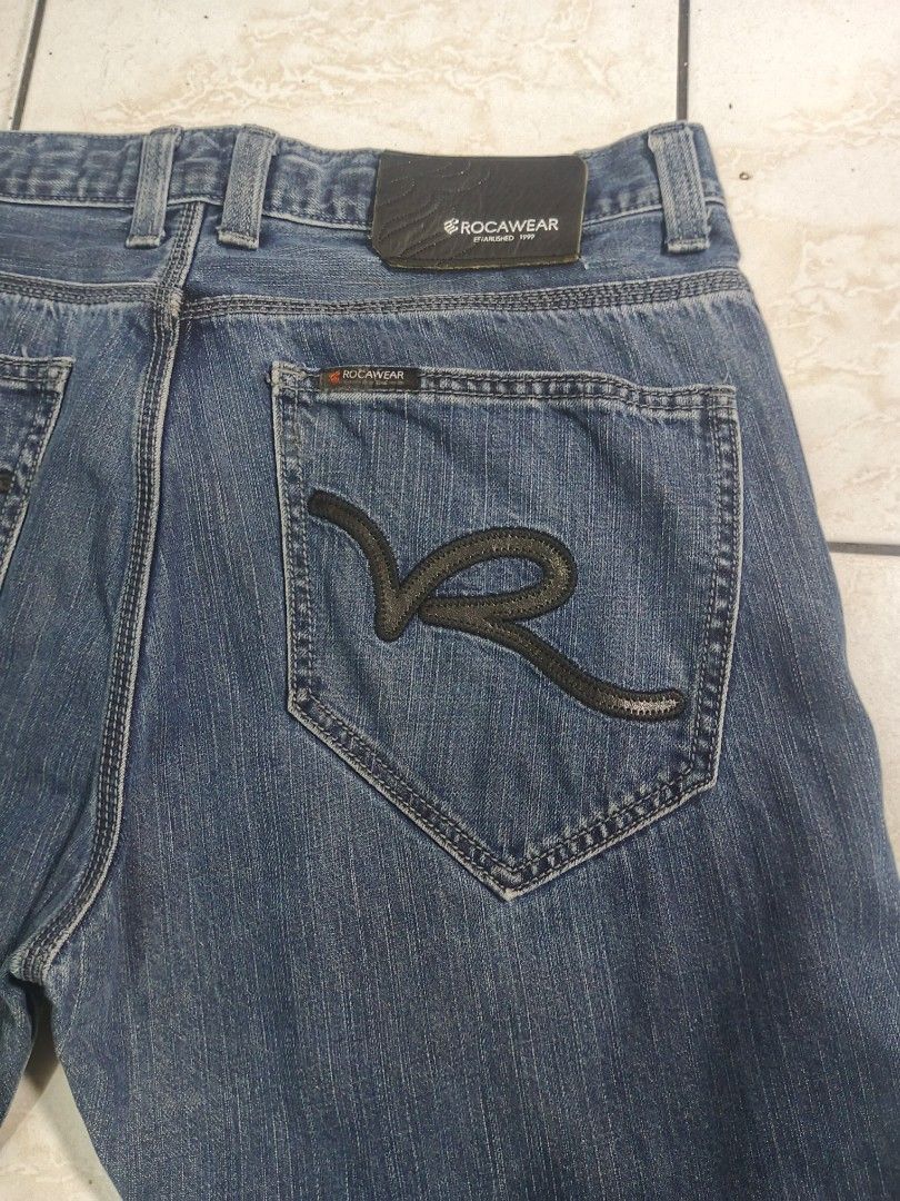 ROCAWEAR PANTS (Category: Jeans) located in Taguig. Submitted by wst.fnds (Listing ID 1468686585, Image 3). Description: ROCAWEAR LIGHT BLUE WASH GOOD CONDITION BAGGY / LOOSE LEATHER DESIGN CHECK PIC FOR MINIMAL ISSUE W:35 / L:40/ T:13.5 / LO:8.5 💸: 499 Keywords: Southpole, Fubu, Karl kani, Rocawear, Evisu, Rmc, Ed Hardy, Sean John, Ecko Unltd, Coogi, Girbaud, Avirex, Ralph Lauren.