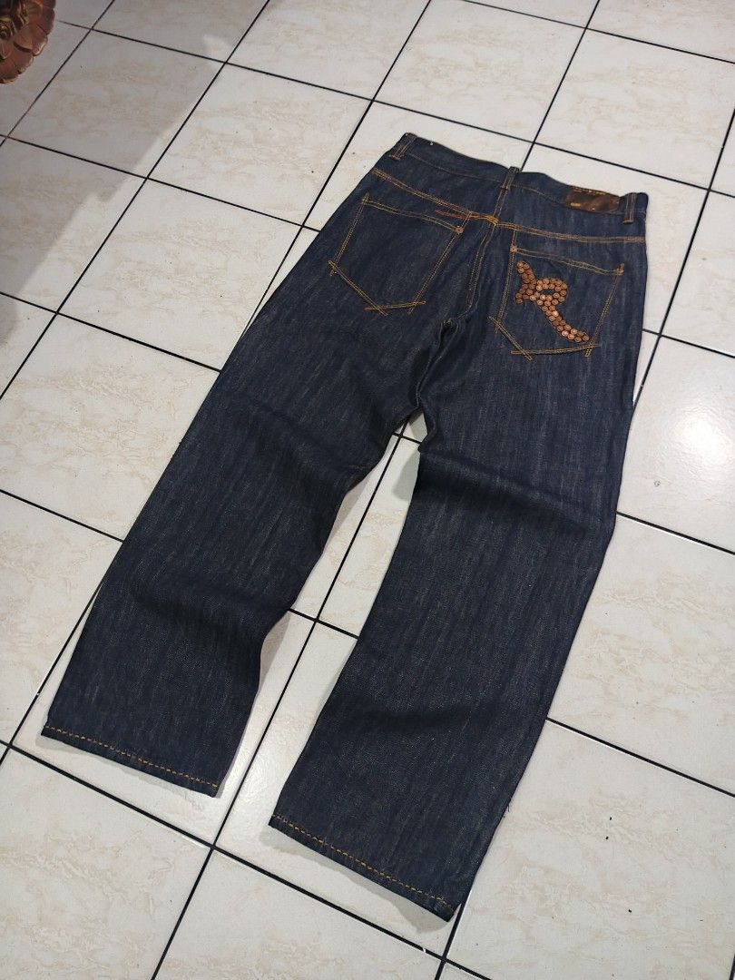 ROCAWEAR RAW DENIM PANTS (Category: Jeans) located in Taguig. Submitted by wst.fnds (Listing ID 1468688215, Image 1). Description: ROCAWEAR RAW DENIM PANTS GOOD CONDITION BAGGY / LOOSE BRONZE DESIGN NO ISSUE FAV PIECE W:34 / L:44 / T:14 / LO:10 💸: 999 Keywords: Southpole, Fubu, Karl kani, Rocawear, Evisu, Rmc, Ed Hardy, Sean John, Ecko Unltd, Coogi, Girbaud, Avirex, Ralph Lauren.