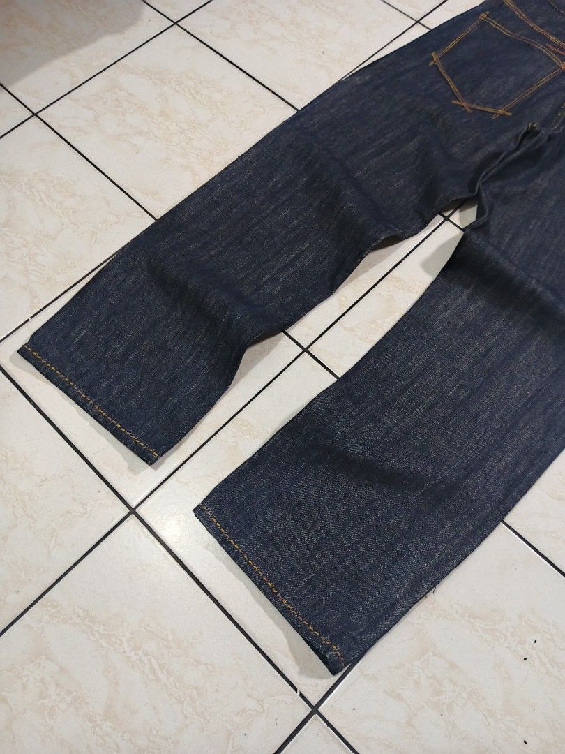ROCAWEAR RAW DENIM PANTS (Category: Jeans) located in Taguig. Submitted by wst.fnds (Listing ID 1468688215, Image 3). Description: ROCAWEAR RAW DENIM PANTS GOOD CONDITION BAGGY / LOOSE BRONZE DESIGN NO ISSUE FAV PIECE W:34 / L:44 / T:14 / LO:10 💸: 999 Keywords: Southpole, Fubu, Karl kani, Rocawear, Evisu, Rmc, Ed Hardy, Sean John, Ecko Unltd, Coogi, Girbaud, Avirex, Ralph Lauren.