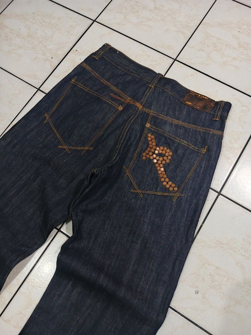 ROCAWEAR RAW DENIM PANTS (Category: Jeans) located in Taguig. Submitted by wst.fnds (Listing ID 1468688215, Image 2). Description: ROCAWEAR RAW DENIM PANTS GOOD CONDITION BAGGY / LOOSE BRONZE DESIGN NO ISSUE FAV PIECE W:34 / L:44 / T:14 / LO:10 💸: 999 Keywords: Southpole, Fubu, Karl kani, Rocawear, Evisu, Rmc, Ed Hardy, Sean John, Ecko Unltd, Coogi, Girbaud, Avirex, Ralph Lauren.