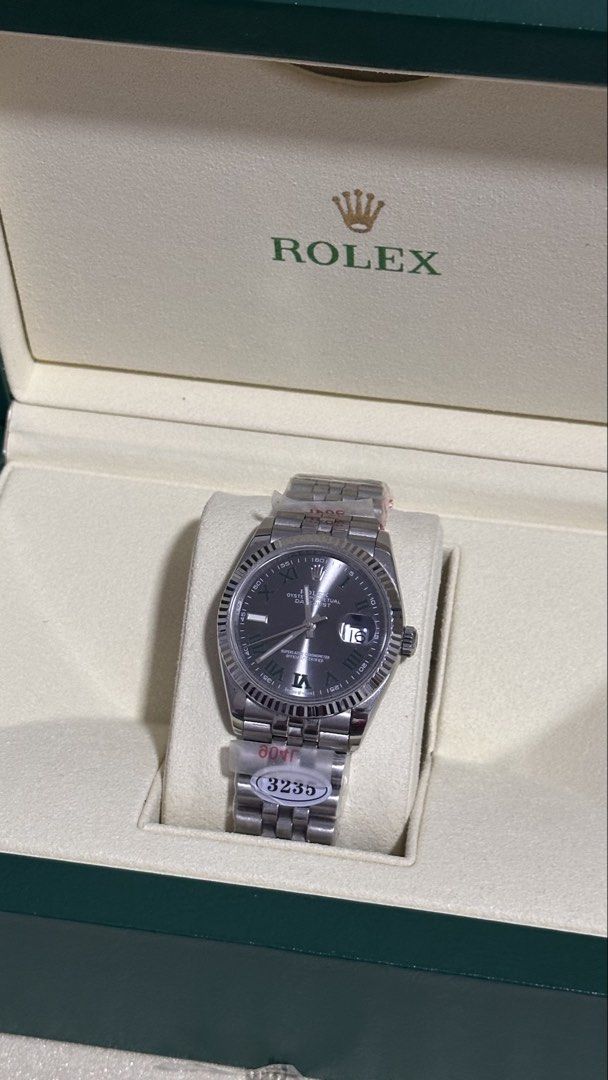 Rolex Datejust 36 "Wimbledon" Dial (Midtier) (Category: Luxury Watches) located in Balanga. Submitted by garahehub (Listing ID 1468501538, Image 1). Description: - Model Style: Datejust 36 - Tier / Quality: Midtier - Dial: Slate Grey “Wimbledon” Dial with Green Roman Numerals - Movement: Automatic Movement (3235 Engraved) - Bezel: Fluted Bezel - Bracelet: Jubilee Bracelet (904L Steel Marked) - Glass: Sapphire Glass with Cyclops Date Lens - Inclus
