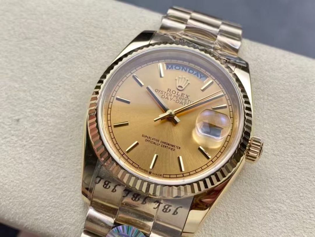 Rolex Day-Date Gold Watch (Category: Luxury Watches) located in Pateros City. Submitted by purebird_714be0 (Listing ID 1468576823, Image 3). Description: - Model: Rolex Day-Date - Material: Full Gold with matching President bracelet - Dial: Champagne dial with baton markers, day at 12, and date at 3 with cyclops lens - Bezel: Iconic fluted bezel - Condition: Brand new, factory plastic wrap still attached on case and bracelet - Authentication: Ori