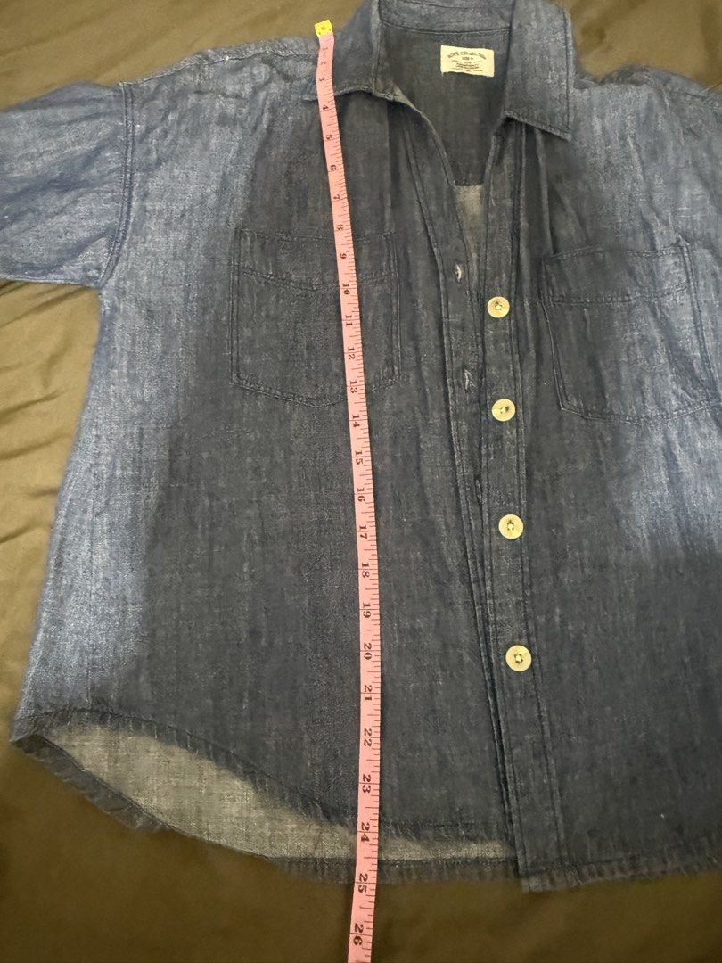 Rope Collection Denim Button-Down Shirt Size Large (Category: Shirts) located in Quezon City. Submitted by turtleandfishes (Listing ID 1468628603, Image 3). Description: - Brand: Rope Collection - Style: Denim shirt with short sleeves and folded cuffs - Color: Medium blue - Details: Classic button-down front with light-colored buttons, two chest pockets, and a curved hemline - Size: Medium (M) - Measurements: ~23 inches chest width, ~26 inches le