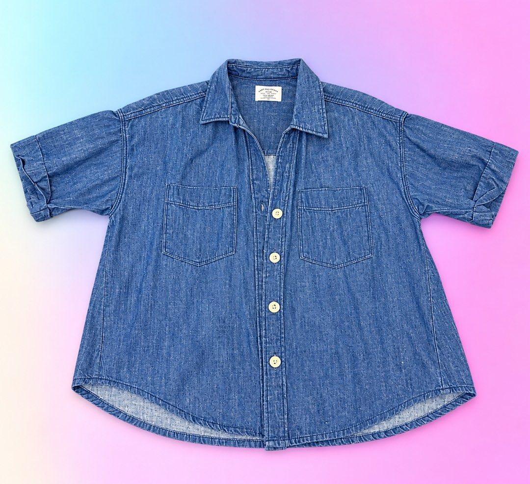 Rope Collection Denim Button-Down Shirt Size Large (Category: Shirts) located in Quezon City. Submitted by turtleandfishes (Listing ID 1468628603, Image 1). Description: - Brand: Rope Collection - Style: Denim shirt with short sleeves and folded cuffs - Color: Medium blue - Details: Classic button-down front with light-colored buttons, two chest pockets, and a curved hemline - Size: Medium (M) - Measurements: ~23 inches chest width, ~26 inches le
