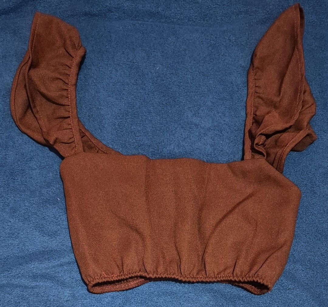 Coordinates Rust Brown Ruffle Crop Top And Tiered Skirt (Category: Sets or Coordinates) located in Imus. Submitted by shopestepanimey (Listing ID 1468553254, Image 1). Description: - Color: Rust brown Size Small - Material: Soft suede-like fabric - Set includes: Crop top (wide ruffle straps, elastic hem) and high-waisted skirt (3-tier ruffled design) - Condition: Worn only a few times, no flaws found - Perfect for: Sunny days and casual outings.