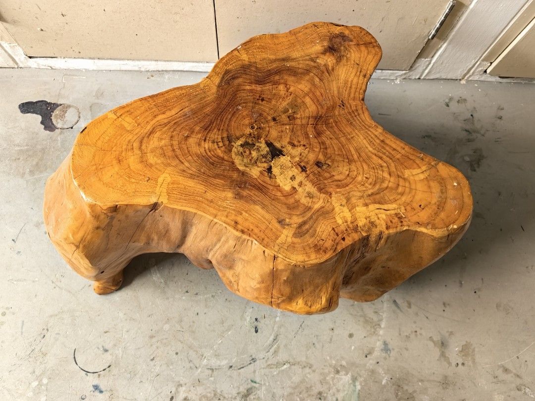Rustic Solid Wood Root Stool Side Table (Category: Chairs) located in Singapore. Submitted by hardyhardy88 (Listing ID 1468540839, Image 2). Description: - Solid natural wood root construction - Gloss finish highlights unique grain patterns and growth rings - Sturdy build with carved leg supports - Versatile use as a small side table or plant stand.