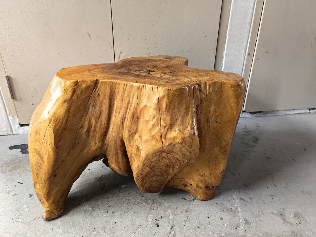 Rustic Solid Wood Root Stool Side Table (Category: Chairs) located in Singapore. Submitted by hardyhardy88 (Listing ID 1468540839, Image 1). Description: - Solid natural wood root construction - Gloss finish highlights unique grain patterns and growth rings - Sturdy build with carved leg supports - Versatile use as a small side table or plant stand.