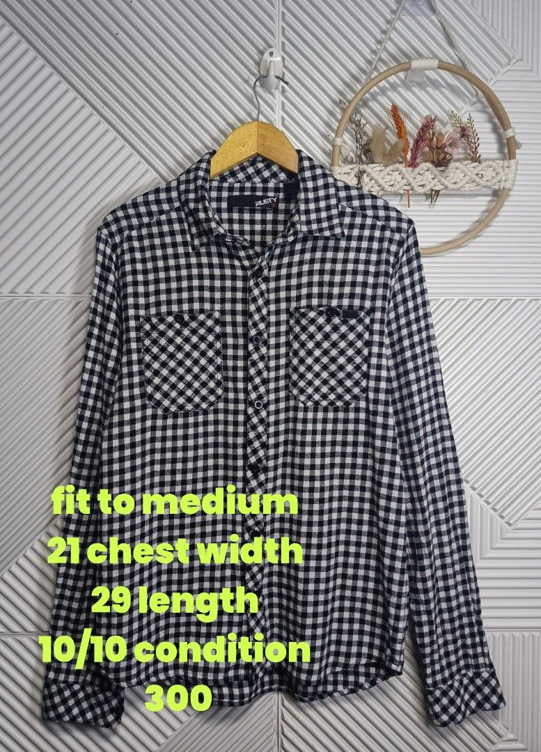 Rusty Black White Checked Flannel Shirt Medium (Category: Tshirts & Polo Shirts ) located in Bulacan. Submitted by cathycampo51092 (Listing ID 1468640963, Image 2). Description: Rusty brand long sleeve button up shirt. Classic black and white gingham check pattern. Dual chest pockets with button flaps. Standard collar. Fits like a medium size. Chest width measures twenty-one inches, length measures twenty-nine inches. Clean fabric, well maintaine