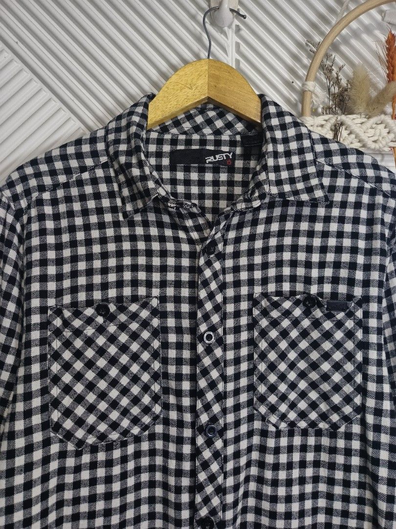 Rusty Black White Checked Flannel Shirt Medium (Category: Tshirts & Polo Shirts ) located in Bulacan. Submitted by cathycampo51092 (Listing ID 1468640963, Image 1). Description: Rusty brand long sleeve button up shirt. Classic black and white gingham check pattern. Dual chest pockets with button flaps. Standard collar. Fits like a medium size. Chest width measures twenty-one inches, length measures twenty-nine inches. Clean fabric, well maintaine
