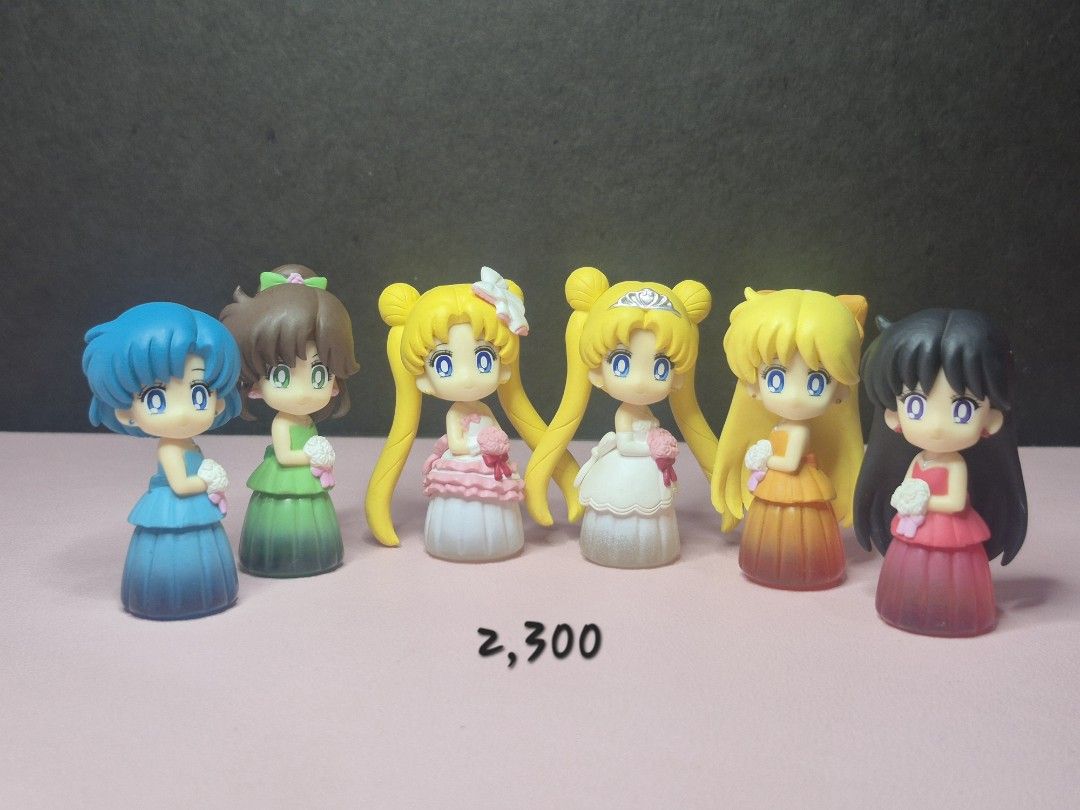 Sailor Moon wedding dress mini figures set (Category: Figurines & Statues) located in Alburquerque. Submitted by magicalbeauty0101 (Listing ID 1468521618, Image 1). Description: - Complete set of 6 Sailor Moon mini figures in gorgeous wedding dresses - Includes Sailor Mercury, Mars, Jupiter, Venus, and Princess Serenity variants - Each chibi figure features detailed hairstyles, colorful gowns, and a small bridal bouquet - Perfect standing display
