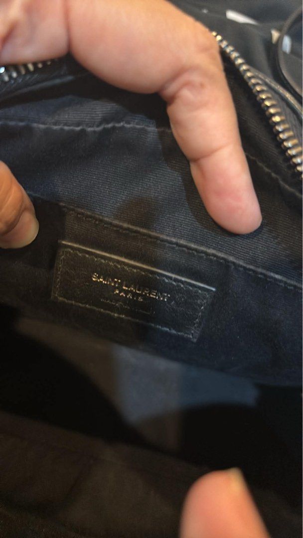 Saint Laurent Lou Camera Bag Black Silver Hardware (Category: Luxury Bags & Wallets) located in Mandaluyong City. Submitted by lucky_len77 (Listing ID 1468672180, Image 2). Description: - Brand: Saint Laurent (YSL) - Material: Black chevron quilted leather with subtle grain texture - Hardware: Silver-tone with iconic front YSL monogram - Details: Matching leather tassel zipper pull and adjustable shoulder strap - Interior: Fabric lining with leat