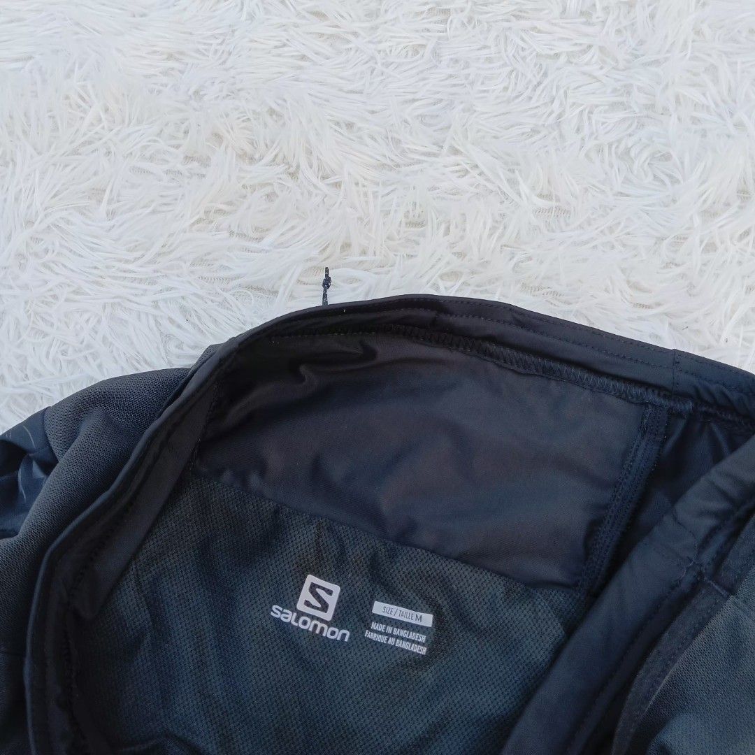 Salomon Black Running Shorts Size M (Category: Shorts) located in Gattaran. Submitted by thrift_wiseph (Listing ID 1468587170, Image 3). Description: - Brand: Salomon - Color: Black - Size: M (Made in Bangladesh) - Design: Patterned fabric with stylish gold Salomon branding and back stripe details - Storage: Built-in waistband pocket with secure zipper closure - Comfort: Breathable interior lining for maximum performance.
