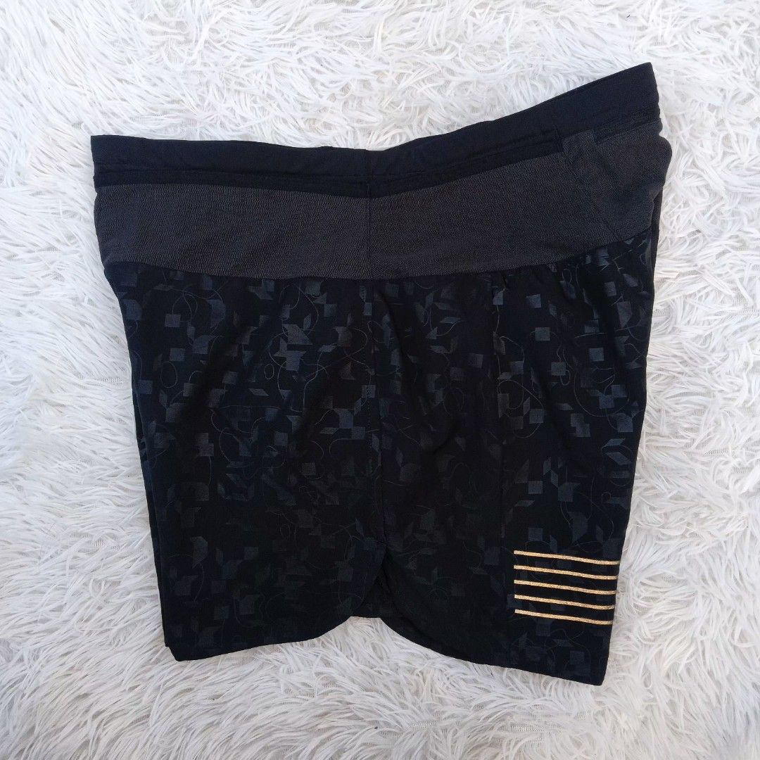Salomon Black Running Shorts Size M (Category: Shorts) located in Gattaran. Submitted by thrift_wiseph (Listing ID 1468587170, Image 2). Description: - Brand: Salomon - Color: Black - Size: M (Made in Bangladesh) - Design: Patterned fabric with stylish gold Salomon branding and back stripe details - Storage: Built-in waistband pocket with secure zipper closure - Comfort: Breathable interior lining for maximum performance.