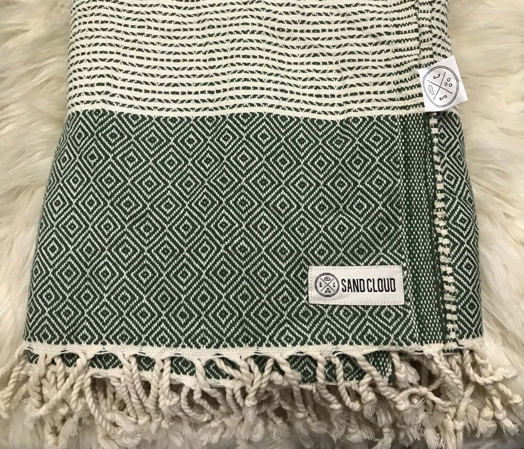 Sand Cloud Turkish Organic Cotton Green Diamond Pattern (Category: Bedding & Towels) located in Imus. Submitted by stop_shop7 (Listing ID 1468548563, Image 2). Description: - Authentic Sand Cloud in forest green and white - Material: 100% Turkish organic cotton, made in Turkey - Design: Traditional diamond geometric pattern with a striped top and twisted fringe trim - Features: Soft textured weave, lightweight, and highly absorbent.