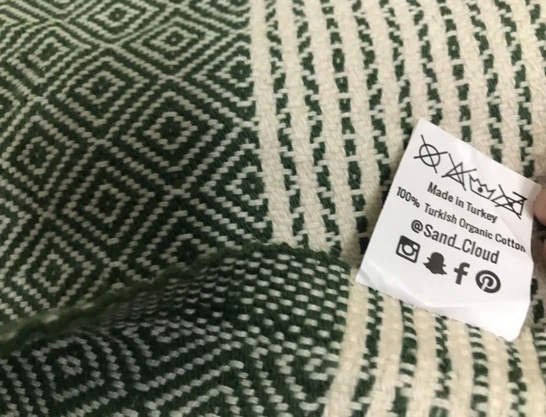 Sand Cloud Turkish Organic Cotton Green Diamond Pattern (Category: Bedding & Towels) located in Imus. Submitted by stop_shop7 (Listing ID 1468548563, Image 3). Description: - Authentic Sand Cloud in forest green and white - Material: 100% Turkish organic cotton, made in Turkey - Design: Traditional diamond geometric pattern with a striped top and twisted fringe trim - Features: Soft textured weave, lightweight, and highly absorbent.