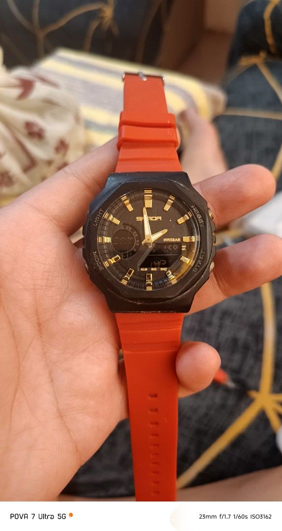 Sanda sports watch (Category: Men's Watches) located in Quezon City. Submitted by junseller18 (Listing ID 1468549172, Image 2). Description: newly replaced battery, has minor issue faded digital clock but still readable.. - Brand/Model: Sanda sports watch - Color: Black case with striking gold hands/indexes and bold orange rubber strap - Display: Analog and digital combination - Case Back: Stainless steel with 5ATM water resistance marking - Cond
