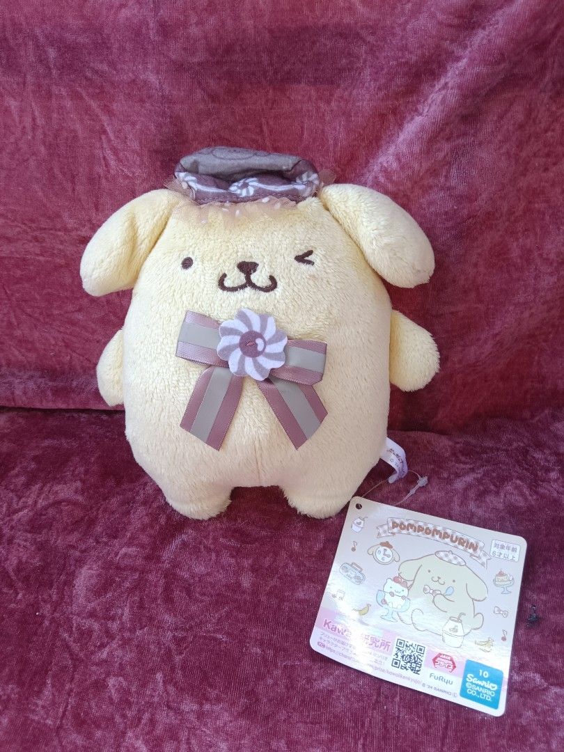 Sanrio Pompompurin and McDonald's Plush Toy Bundle (Category: Plushies & Soft Toys) located in Cabuyao City. Submitted by jimcollections (Listing ID 1468685122, Image 3). Description: - Authentic Sanrio Pompompurin plush toy bundle (set of 3) - Plush 1: Features an orange and white ribbon with a cup hat and includes an official swing tag - Plush 2: Adorable winking expression wearing a purple bonnet and matching bow - Plush 3: Dressed in a green 
