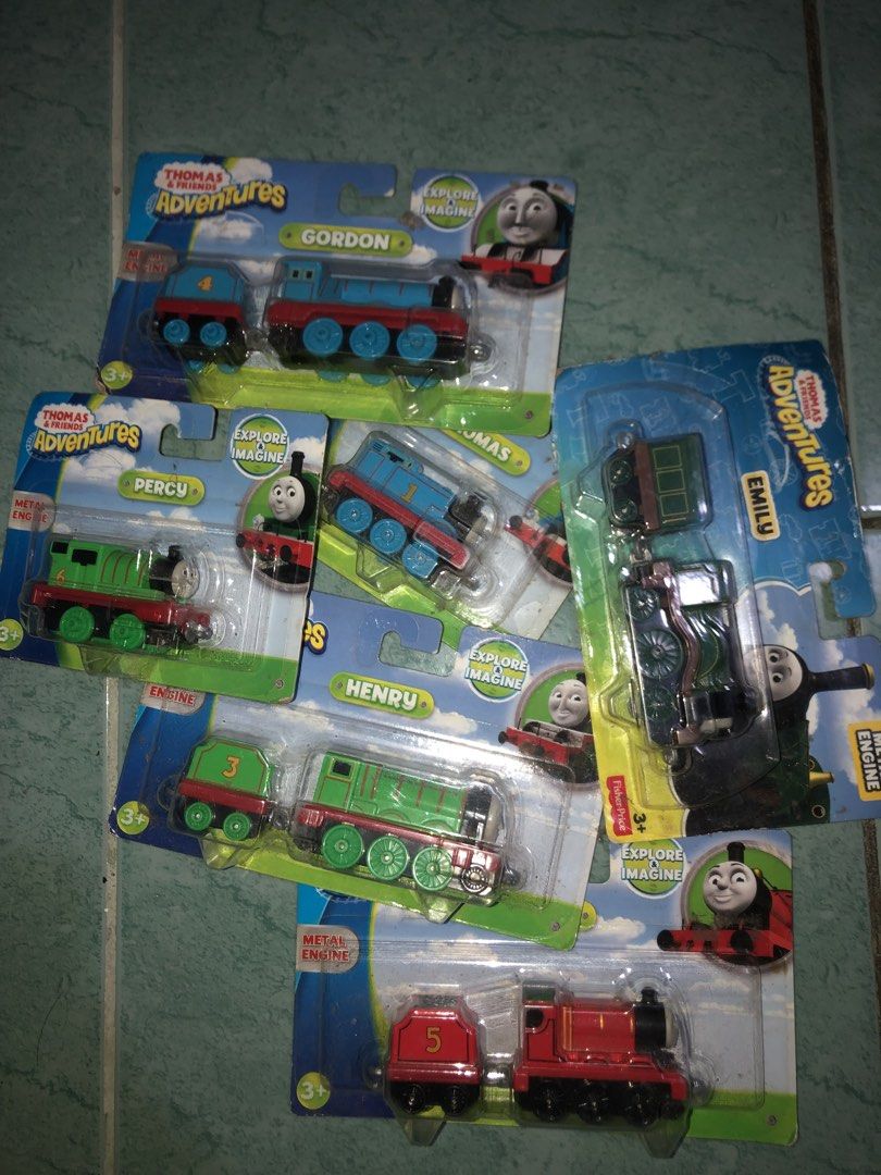 Sealed Thomas & Friends Adventures Metal Engine Toy Train Set (6 Pack) (Category: Vehicle & Diecast Models) located in Angeles City. Submitted by bratzdylan (Listing ID 1468647360, Image 3). Description: - Complete set of 6 Thomas & Friends Adventures metal engine toy trains - Includes fan-favorite characters: Gordon, Emily, Percy, Thomas, Henry, and James - 100% brand new in original, unopened blister pack packaging - Perfect gift for young chil