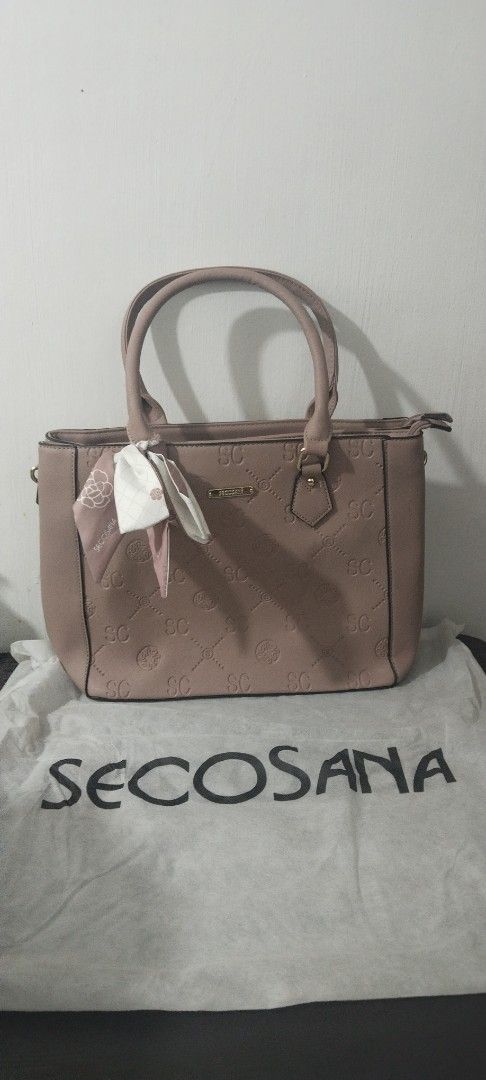 SECOSANA Two-Way Bag (Category: Luxury Bags & Wallets) located in Marikina City. Submitted by jhazielle (Listing ID 1468515079, Image 3). Description: FOR SALE‼️ SECOSANA BAG ✅Style: structured tote / shoulder bag/sling bag ✅2 Compartments with Exterior back zip pocket - interior zip pocket and 2 slip-in pockets. ✅Comes with a dust bag . ✅Comes with a decorative scarf. ✅Condition: Excellent, Good as new(used twice lang) well-maintained ✅ Original