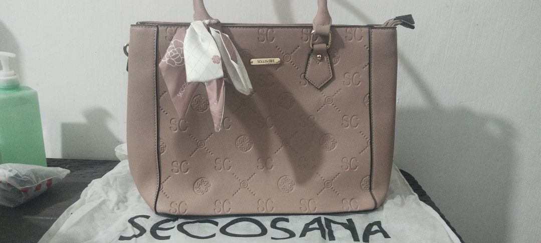 SECOSANA Two-Way Bag (Category: Luxury Bags & Wallets) located in Marikina City. Submitted by jhazielle (Listing ID 1468515079, Image 2). Description: FOR SALE‼️ SECOSANA BAG ✅Style: structured tote / shoulder bag/sling bag ✅2 Compartments with Exterior back zip pocket - interior zip pocket and 2 slip-in pockets. ✅Comes with a dust bag . ✅Comes with a decorative scarf. ✅Condition: Excellent, Good as new(used twice lang) well-maintained ✅ Original