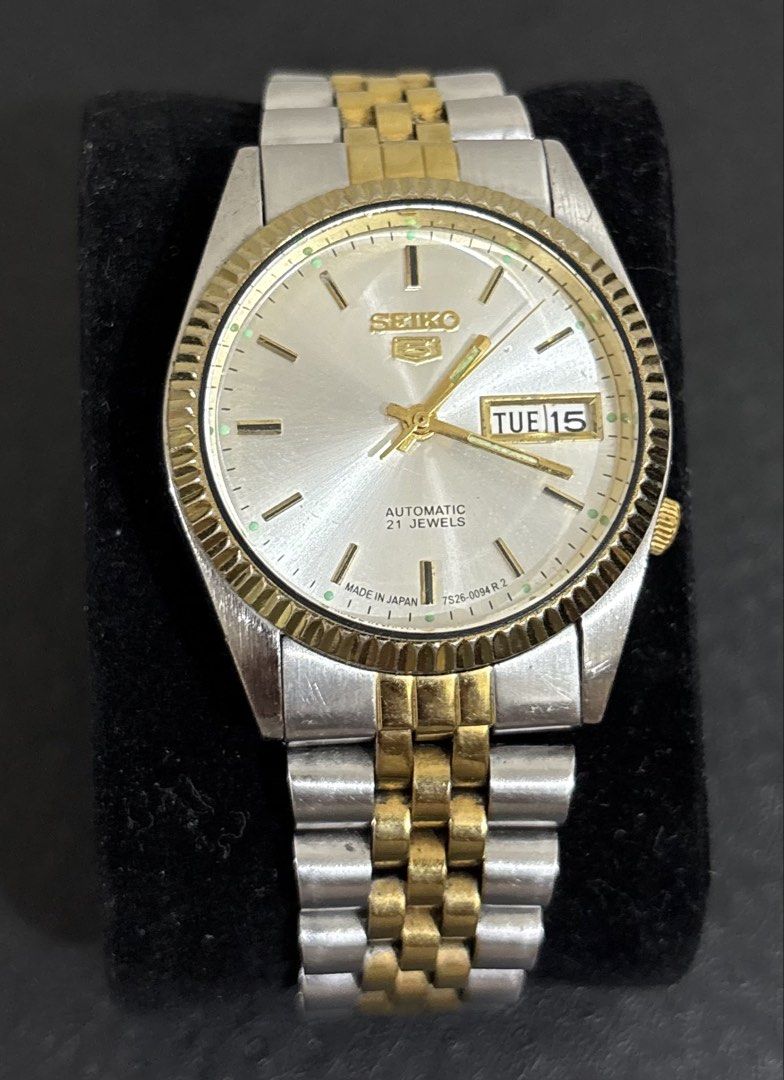 Seiko 5 Automatic Two-Tone Fluted Bezel Watch (Category: Men's Watches) located in Binangonan. Submitted by joeydrs06 (Listing ID 1468507448, Image 1). Description: - Brand/Model: Seiko 5 Automatic - Dial: Silver sunburst with gold hands and hour markers - Features: Day and date window at 3 o'clock - Movement: Made in Japan 7S26 automatic (keeps good time) - Bracelet/Bezel: Two-tone steel and gold jubilee bracelet with fluted gold-tone bezel - Co