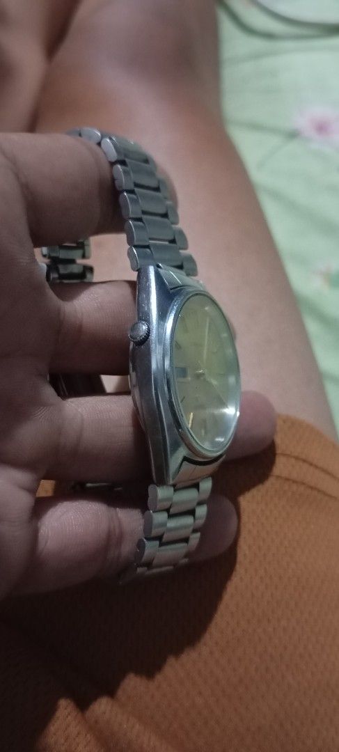 Seiko 5 Automatic Vintage Watch 7009-876A (Category: Men's Watches) located in Manila. Submitted by jhonevanma58082 (Listing ID 1468642545, Image 3). Description: - Brand: Seiko 5 Automatic - Dial: Champagne gold with day-date function at 3 o'clock - Case & Bracelet: Silver-tone metal with matching steel bracelet - Reference: Serial #474074, Movement Ref. 7009-876A - Condition: Noticeable wear on crystal, case, and bracelet from regular use - Fun