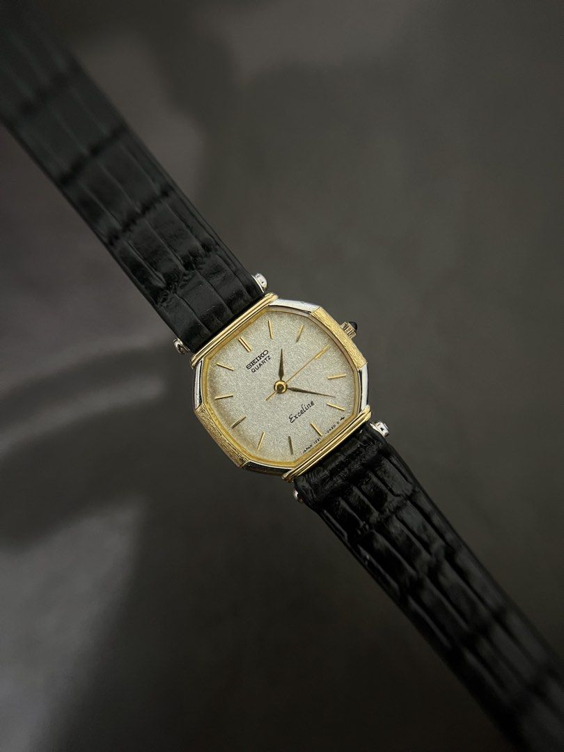 Seiko Exceline Snowflake Dial Two-Tone Tank – Ref. 1221-5260 (Category: Women's Watches) located in Quezon City. Submitted by bobby.brown. (Listing ID 1468507856, Image 1). Description: Seiko Exceline Snowflake Dial Two-Tone Tank – Ref. 1221-5260 Estimated BMBY: July 1983 An elegant vintage dress watch from Seiko’s high-end Exceline collection, featuring an octagonal tank-style two-tone case with a textured gold-tone bezel and silver-tone accents