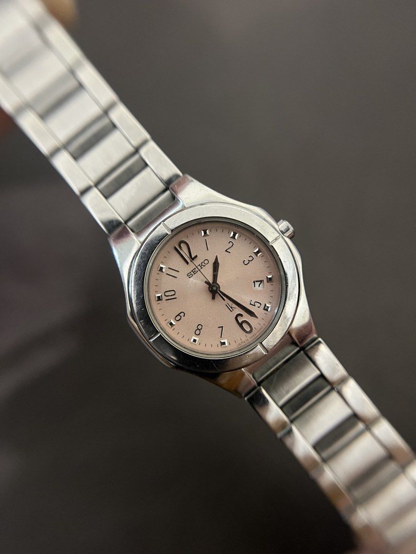 Seiko Lukia Pink Dial Quartz – Ref. 7N82-0AX0 (Category: Women's Watches) located in Quezon City. Submitted by bobby.brown. (Listing ID 1468508363, Image 1). Description: Seiko Lukia Pink Dial Quartz – Ref. 7N82-0AX0 Estimated BMBY: September 2003 A charming modern dress watch from Seiko’s popular Lukia collection, featuring a polished stainless steel case with contoured bezel tabs and a matching integrated stainless steel bracelet. The subtle bl