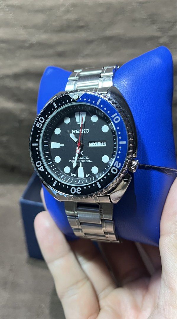 Seiko Prospex Turtle Automatic Diver's Watch (Category: Men's Watches) located in Cebu City. Submitted by jov_146 (Listing ID 1468555063, Image 1). Description: - Brand: Seiko - Movement: Automatic - Dial: Classic black with day-date window at 3 o'clock - Bezel: Blue and black (Batman style) - Material: Stainless steel bracelet and polished case - Crystal: Clean and scratch-free - Water Resistance: 200m - Condition: Runs smoothly, well-maintained