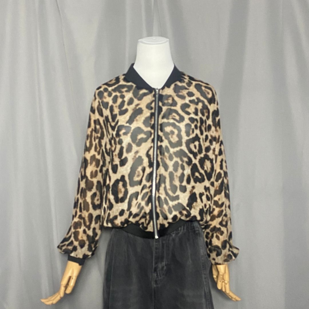 Sheer lightweight, zip-up leopard-print bomber jacket (Category: Longsleeves) located in Las Pinas. Submitted by ipickyou (Listing ID 1468676139, Image 1). Description: Unwashed Condition: 10/10 𝗠𝗲𝗮𝘀𝘂𝗿𝗲𝗺𝗲𝗻𝘁𝘀 𝘄𝗵𝗲𝗻 𝗹𝗮𝗶𝗱 𝗳𝗹𝗮𝘁: -Length: 22” .