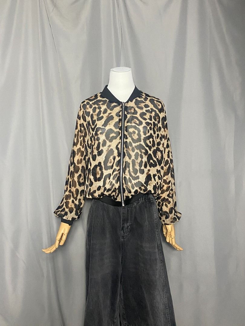 Sheer lightweight, zip-up leopard-print bomber jacket (Category: Longsleeves) located in Las Pinas. Submitted by ipickyou (Listing ID 1468676139, Image 2). Description: Unwashed Condition: 10/10 𝗠𝗲𝗮𝘀𝘂𝗿𝗲𝗺𝗲𝗻𝘁𝘀 𝘄𝗵𝗲𝗻 𝗹𝗮𝗶𝗱 𝗳𝗹𝗮𝘁: -Length: 22” .