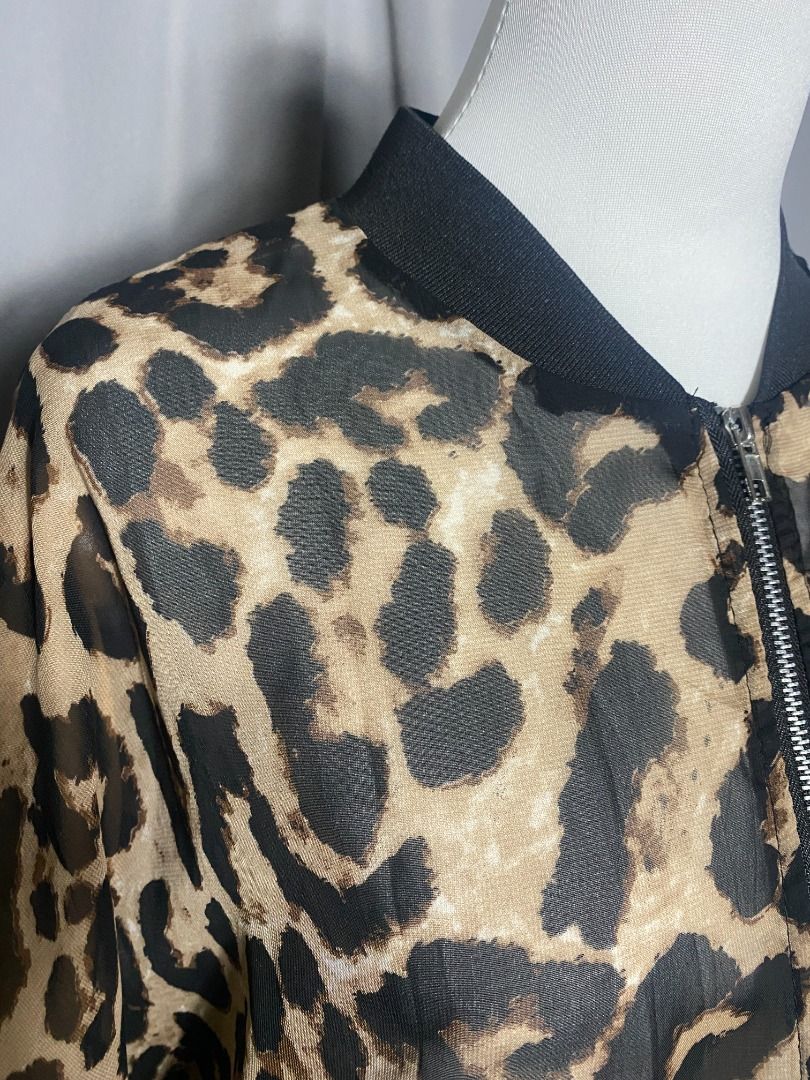 Sheer lightweight, zip-up leopard-print bomber jacket (Category: Longsleeves) located in Las Pinas. Submitted by ipickyou (Listing ID 1468676139, Image 3). Description: Unwashed Condition: 10/10 𝗠𝗲𝗮𝘀𝘂𝗿𝗲𝗺𝗲𝗻𝘁𝘀 𝘄𝗵𝗲𝗻 𝗹𝗮𝗶𝗱 𝗳𝗹𝗮𝘁: -Length: 22” .