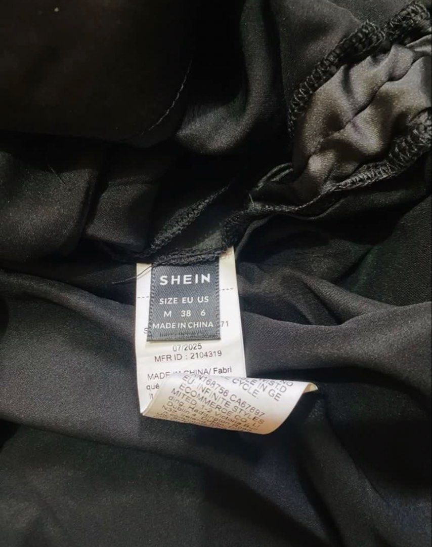 SHEIN Black Satin Drawstring Sides Top (Category: Blouses) located in Marikina City. Submitted by jessylady10 (Listing ID 1468633072, Image 3). Description: - Brand: SHEIN - Color: Black - Material: Smooth, shiny satin - Size: M (EU 38, US 6) - Condition: Brand new with tag, still in original plastic packaging - Features: Adjustable side drawstrings for a customized fit, round neckline, short sleeves Gcash payment and lalamove delivery or J&T shi